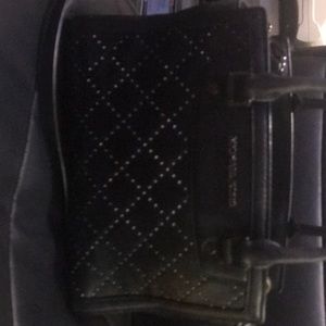 MK studded Selma black bag.